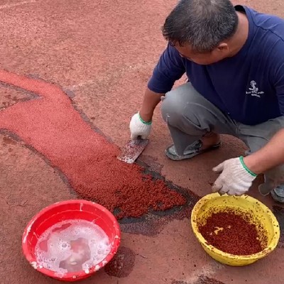 Réparation de piste d'athlétisme